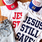 Jesus Still Saves White Tee | Red, White, & Blue